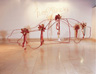 Untitled, 2003, iron, wallpaper, ribbons, 135 x 480 x 180 cm